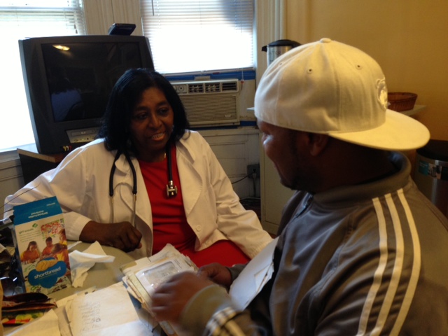 Nurse Martha Tisdale meets with a guest at Garden State Episcopal CDC's Drop-In Center. PHOTO COURTESY GSECDC
