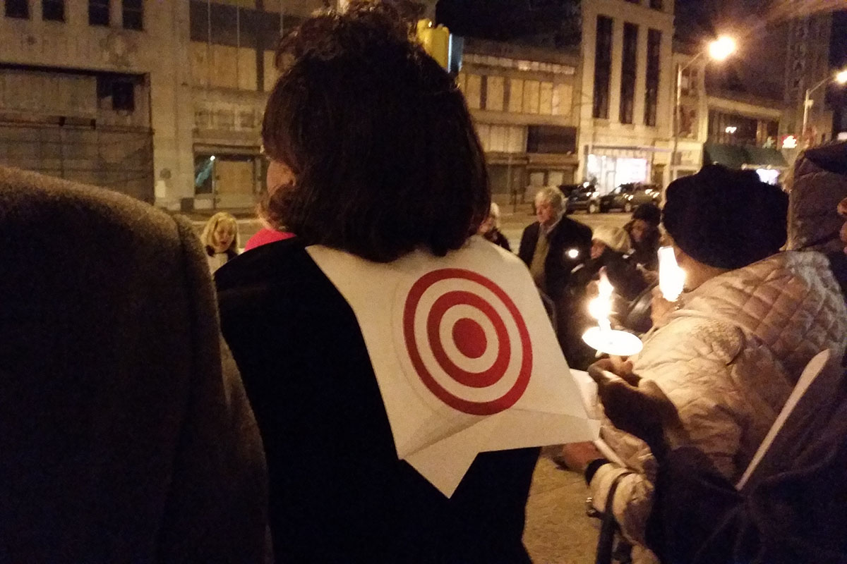 Candlelight Vigil for Peace - attendee wearing bull's-eye