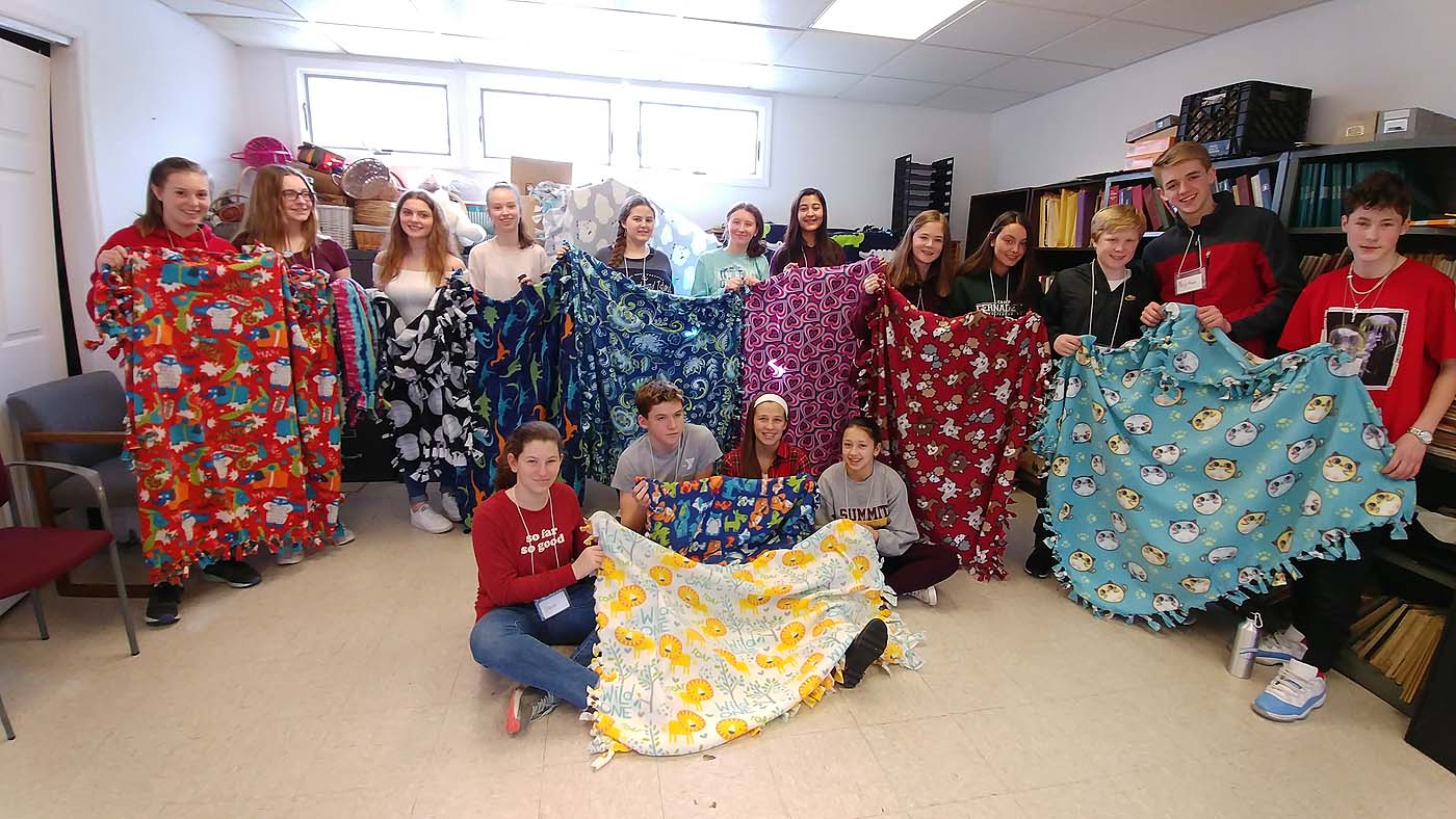 The confirmands made blankets for sick children in one of their Confirmation Retreat workshops.