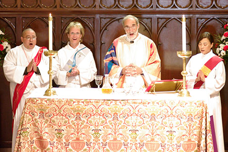 Bishop Beckwith with three new transitional deacons.