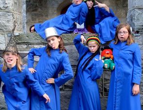 Members of Grace, Madison school choirs practice scary Halloween faces.