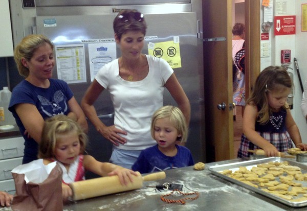 Grace, Madison children rolling out dough for dog biscuits