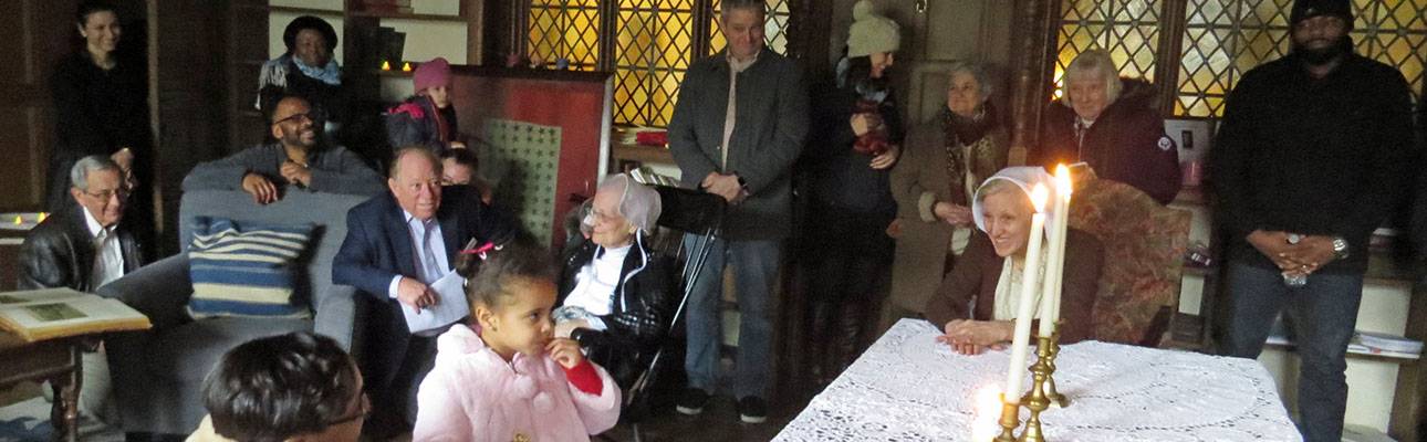 Quaker abolitionist Sarah Grimke, portrayed by St. James Warden Barbara Boehm, greets one of the young “escaped slaves” she and her family shelter in her home during a re-enactment of the Underground Railroad. SHARON SHERIDAN PHOTO