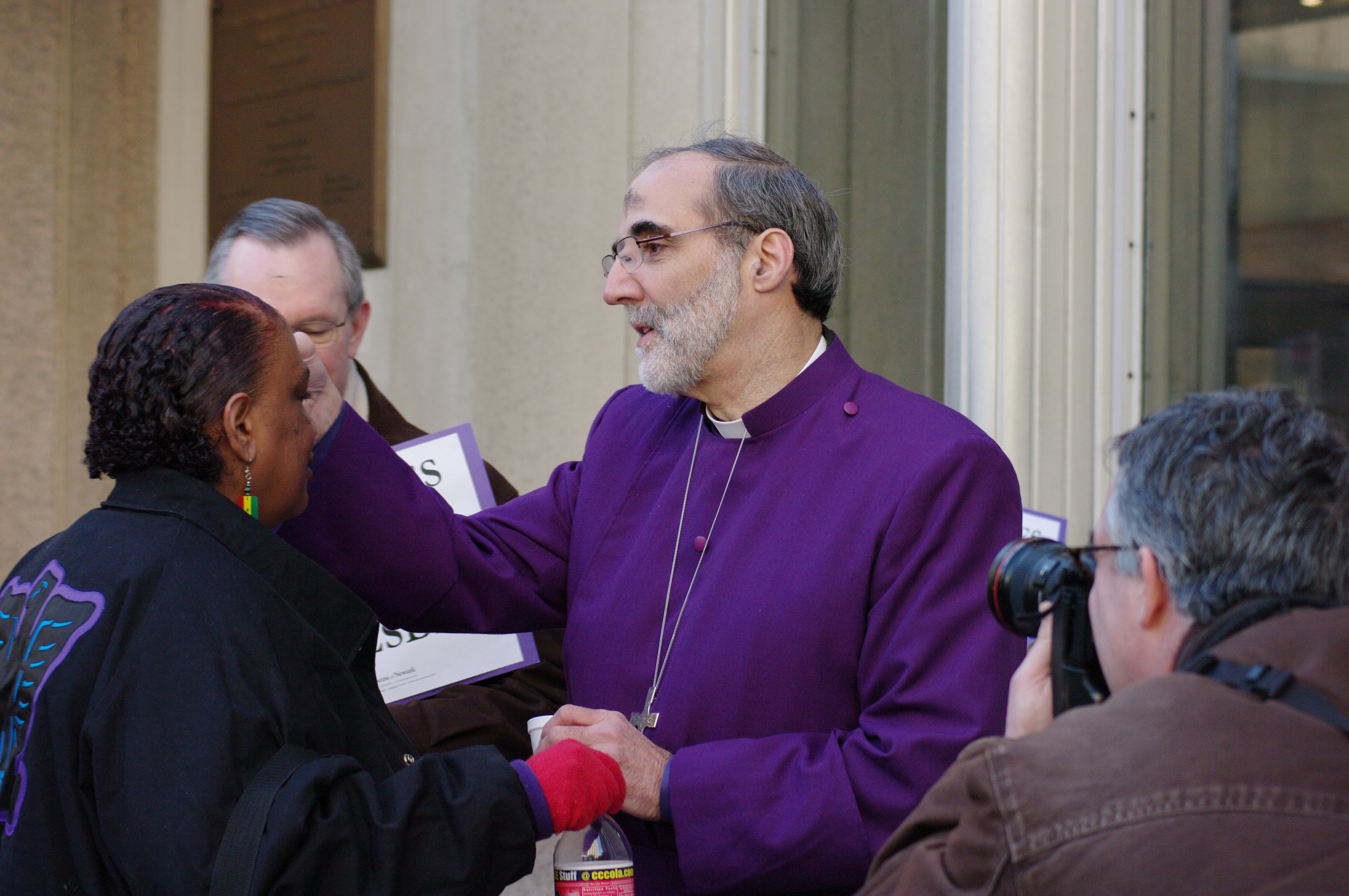 Bishop Mark Beckwith giving "Ashes to Go" at Newark Penn Station