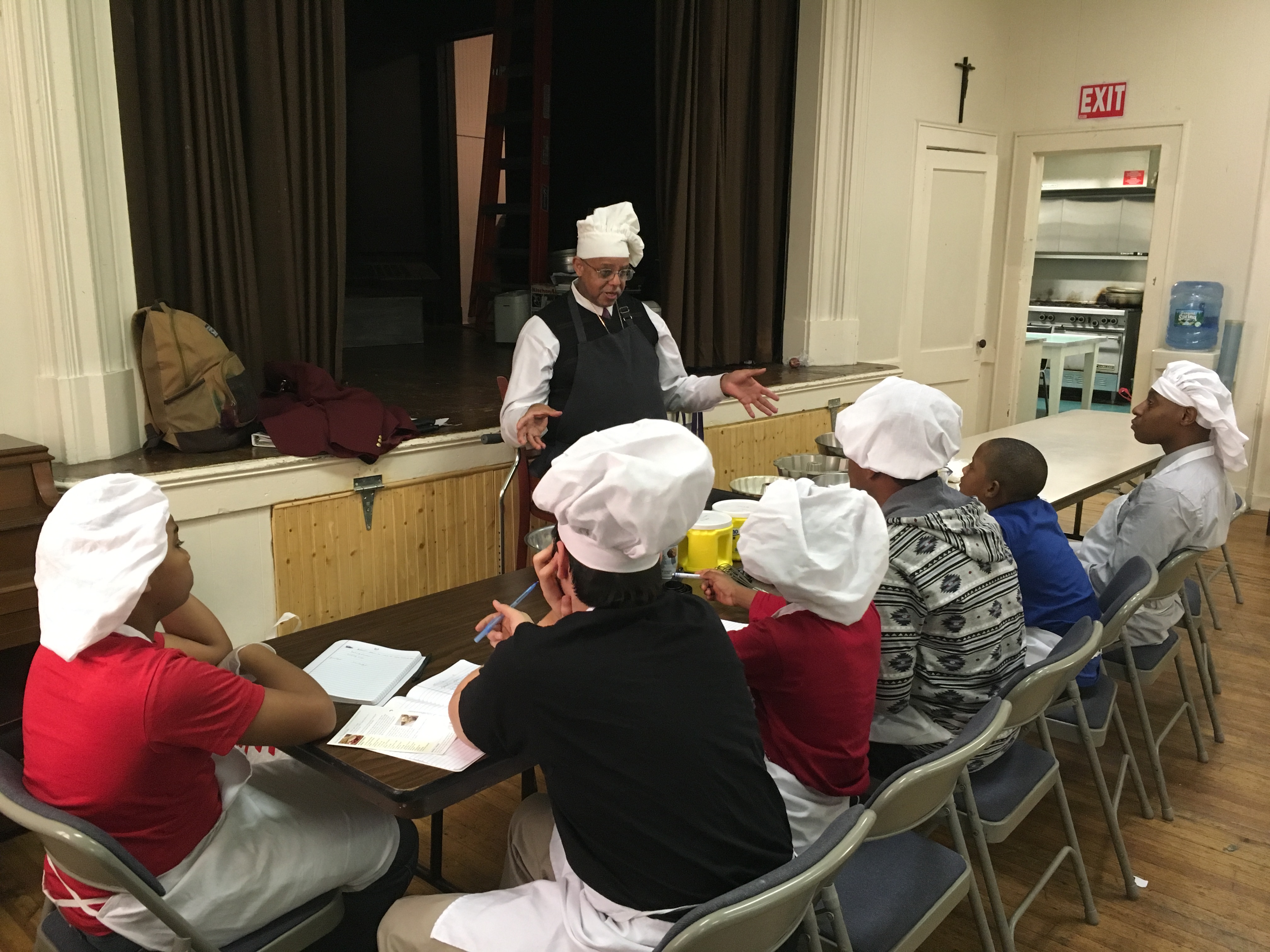 Eric Petersen of St. Paul's teaches a kitchen skills class.