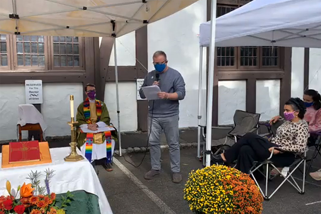 In-person worship at St. George's, Maplewood, held outdoors in the parking lot under canopies.