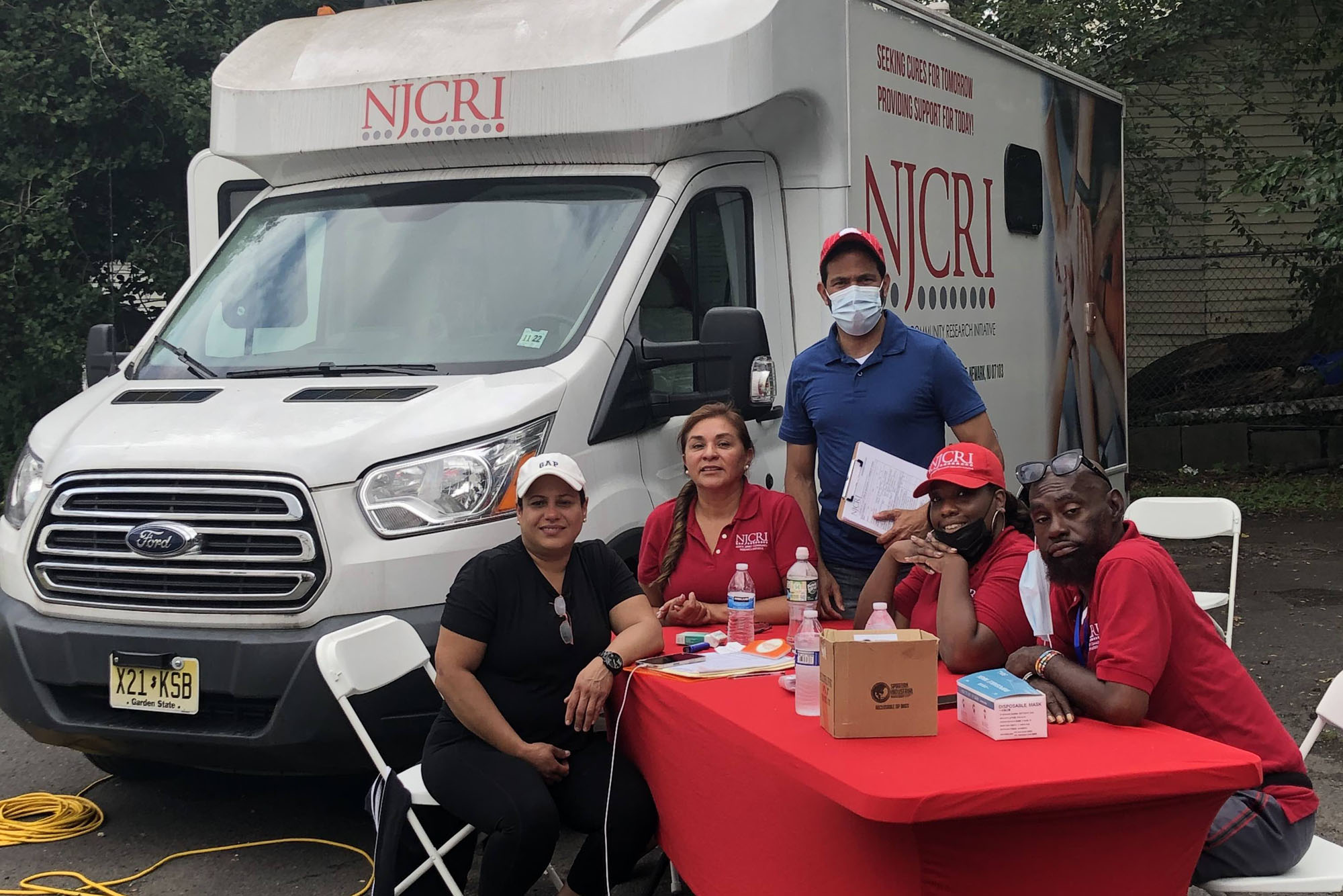 The NJCRI team and their mobile COVID vaccine clinic. ALEEDA CRAWLEY PHOTO