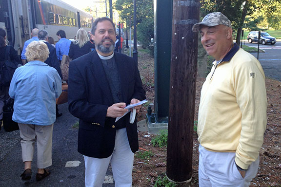 The Rev. John Perris and Cole Russo of St. James' at the Upper Montclair train s