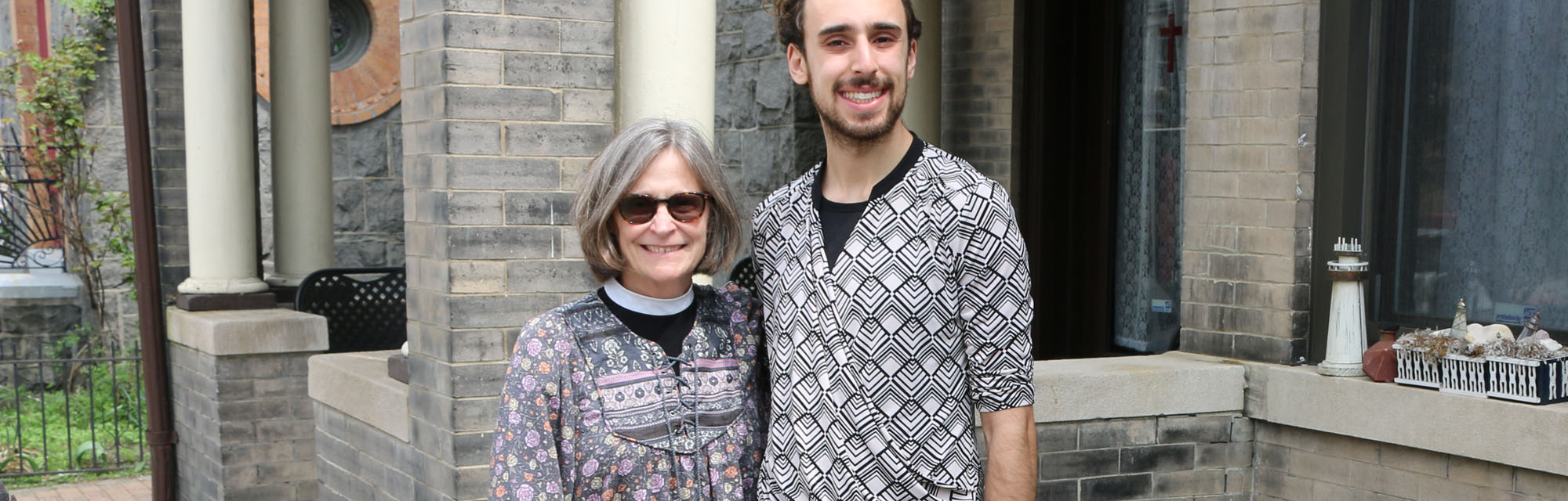 The Rev. Deacon Jill Singleton, Director and Chaplain of The Lighthouse, with part-time social worker Jacob Pirogovsky, in front of The Lighthouse last April. NINA NICHOLSON PHOTO