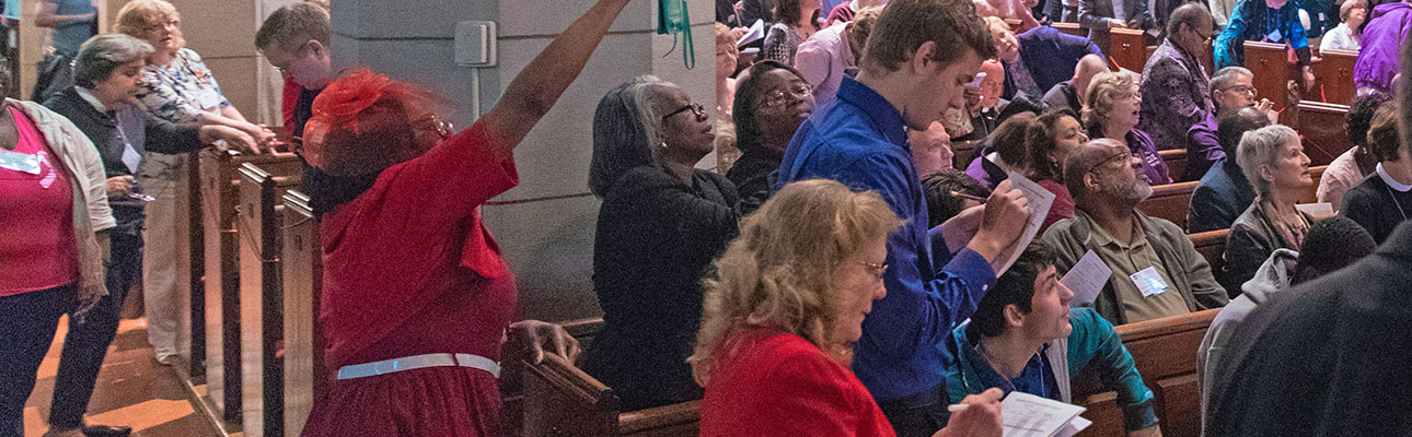 Two youth deputies (front pew in blue shirts) react to the election of the XI Bishop of Newark. CYNTHIA BLACK PHOTO