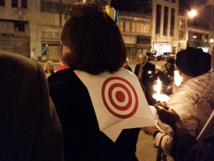 Candlelight Vigil for Peace - attendee wearing bull's-eye