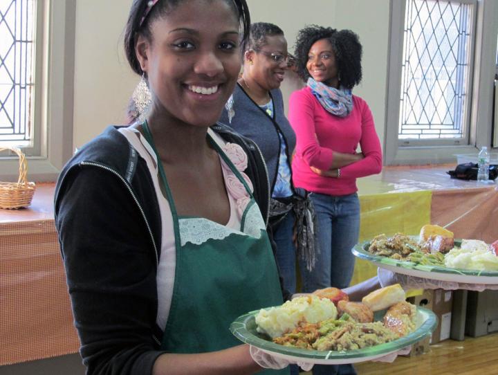 A volunteer serving meals.