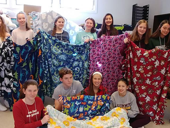 The confirmands made blankets for sick children in one of their Confirmation Retreat workshops.