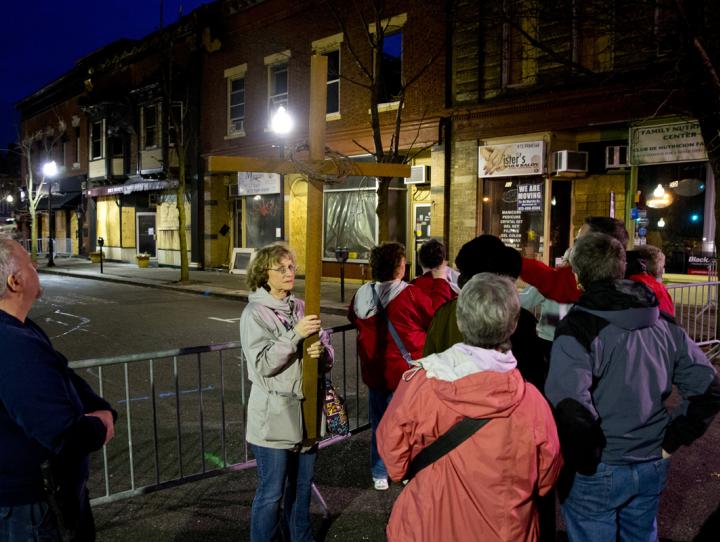 Debi Post pauses after readings at the site of the Elm Street fire in Morristown