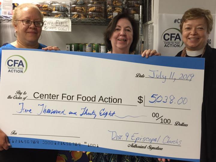 Claudia Smith of St. Luke’s, Haworth and co-chair of our 2019 Lenten Offering Committee (left) and the Rev. Lynne Bleich Weber, District 9 Convener (right) present a check to Pat Espy, Executive Director of the Center for Food Action.