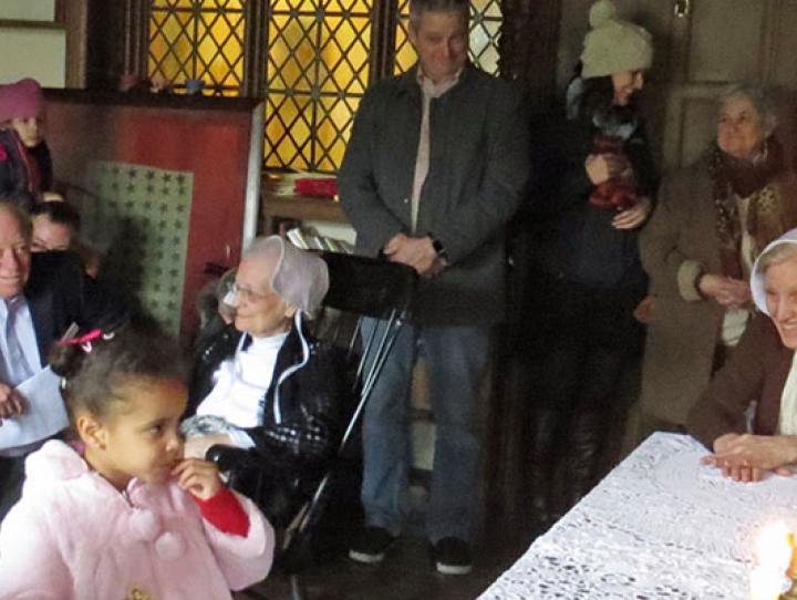 Quaker abolitionist Sarah Grimke, portrayed by St. James Warden Barbara Boehm, greets one of the young “escaped slaves” she and her family shelter in her home during a re-enactment of the Underground Railroad. SHARON SHERIDAN PHOTO