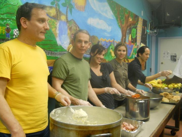 Volunteers serve meals at the Hoboken Homeless Shelter.