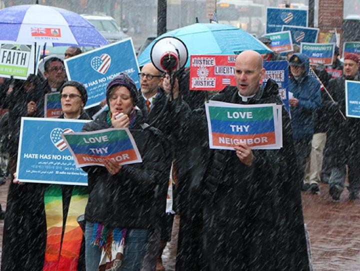 The Rev. Diana Wilcox and the Rev. John Mennell at the front of the march down Broad Street in Newark to the Federal Building, where they joined Senator Bob Menendez and Cardinal Joseph Tobin, Archbishop of Newark for a vigil and press conference supporting Catalino Guerrero during his meeting with federal immigration officials. NINA NICHOLSON PHOTO