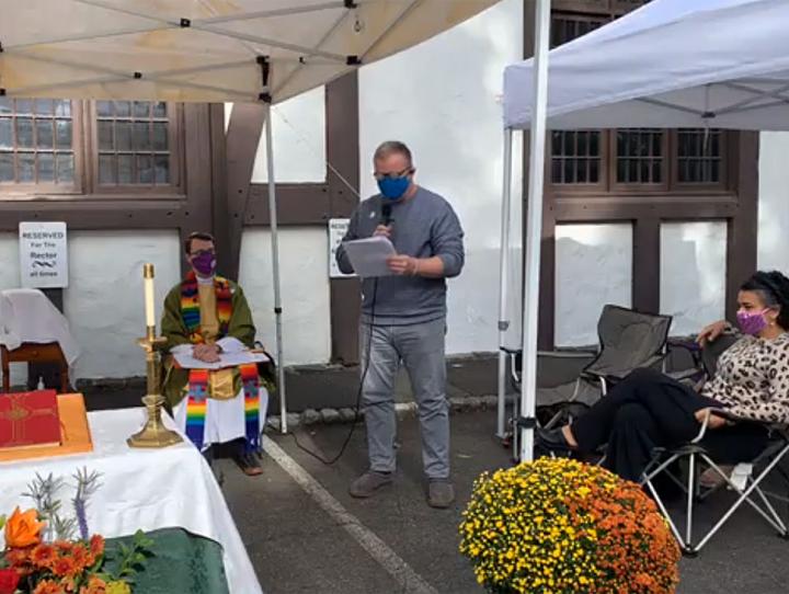 In-person worship at St. George's, Maplewood, held outdoors in the parking lot under canopies.