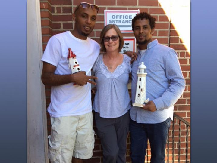 Jill Singleton with two guests at The Lighthouse, which she helped establish to provide temporary housing and resettlement for asylum seekers after released from detention.