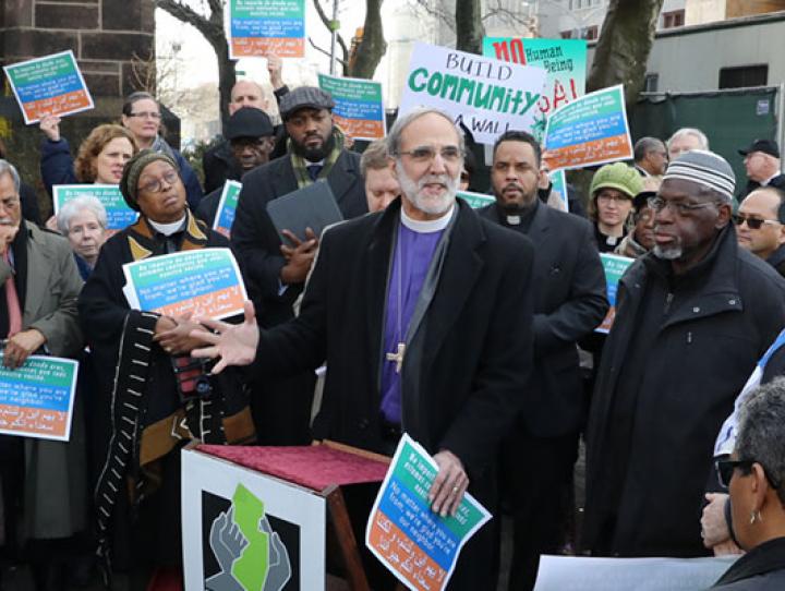 Bishop Mark Beckwith addresses the gathering in front of Grace Church in Newark, next to the Federal Building where deportation hearings are held. CYNTHIA BLACK PHOTO