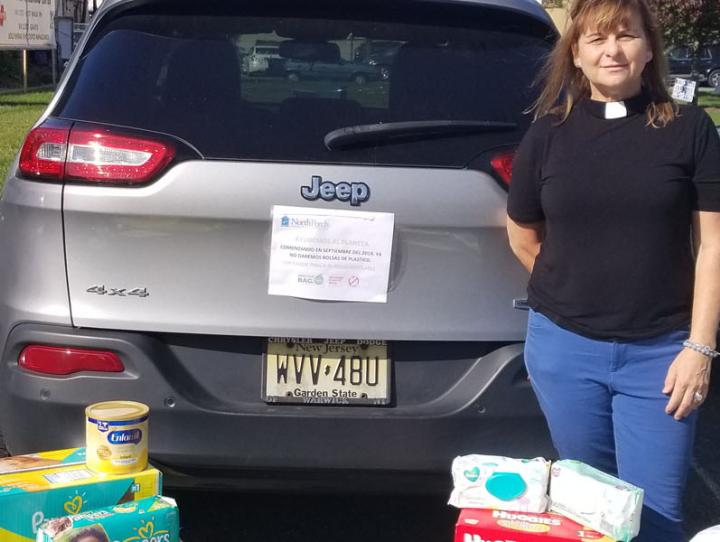 The Rev. Ellen Kohn-Perry, president of North Porch, with donations at their Dover location.