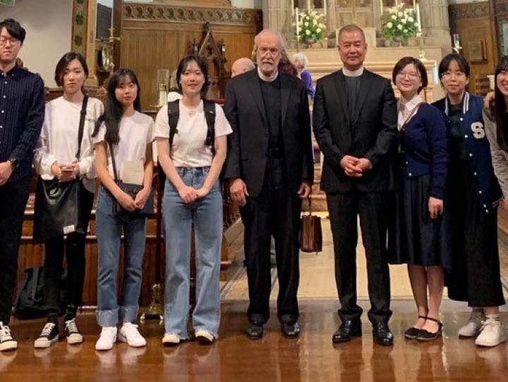 The Rev. Matthew Corkern, Rector of Calvary Summit (left), the Rev. Robert Corin Morris (6th from left) and the Rev. Dr. Joo Yup Lee (7th from left) with South Korean students. PHOTO COURTESY ROBERT CORIN MORRIS