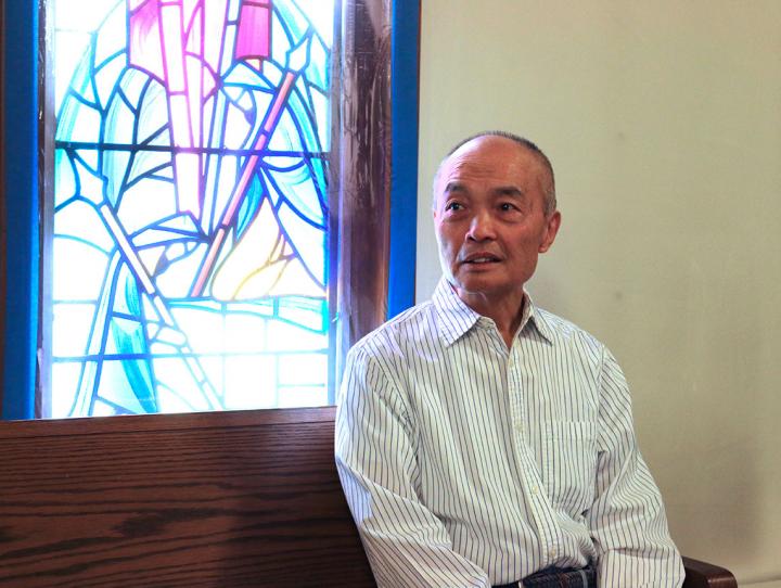 Gary Eng pauses for a moment of reflection in the nave of St. Paul's, North Arlington. NINA NICHOLSON PHOTO