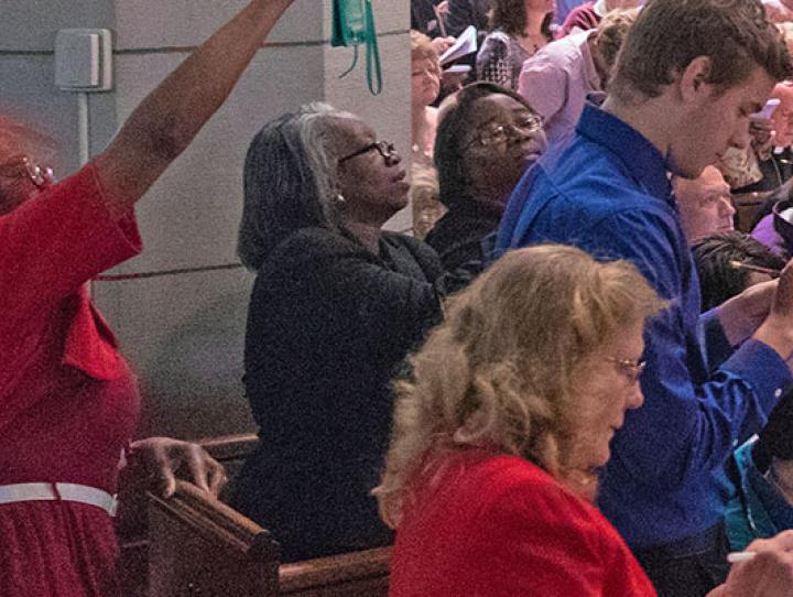 Two youth deputies (front pew in blue shirts) react to the election of the XI Bishop of Newark. CYNTHIA BLACK PHOTO