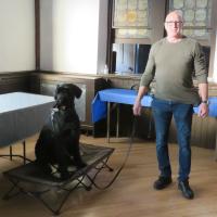 Chris Kline and his dog Bowie wait in the parish hall at St. John’s, Boonton while their trainer hides pseudo-explosives for them to find in the church. SHARON SHERIDAN HAUSMAN PHOTO