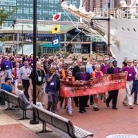 Bishops United Against Gun Violence led a march through the inner harbor area to the site of a homicide which had occurred the night before the opening of the 80th General Convention of the Episcopal Church.