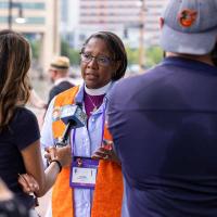 Bishop Jennifer Baskerville-Burrows, Bishop of Indianapolis, speaks to the media following a vigil organized by Bishops United Against Gun Violence at the site of a homicide.