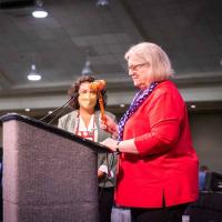 President Gay Jennings signals the close of the 80th General Convention as her successor, President-elect Julia Ayala-Harris prepares to take up the gavel.