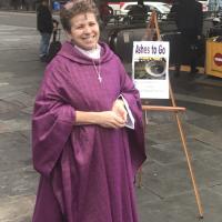 The Rev. Laurie Wurm of Grace Church Van Vorst, Jersey City at the Grove Street PATH Station. BERNICE DAVIS PHOTO