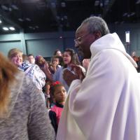 July 5: Presiding Bishop Michael Curry visits the children's area during the opening Eucharist. SHARON SHERIDAN PHOTO
