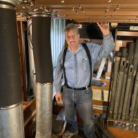 Mark Wright inside the pipe organ structure.