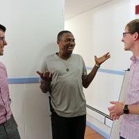 Christopher Jennings and Chris Whitaker talk with Tommy Lovett (center), House of Prayer's sexton. Lovett helped facilitate the renovation of the classroom space, and plans to be in the first group of students. NINA NICHOLSON PHOTO