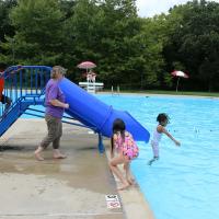 It wasn't longer after entering the pool that the children felt comfortable trying out the slide.