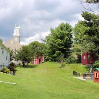 The back yard of the cottage. St. Luke's, Hope is visible in the background.
