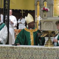 Presiding Bishop Michael Curry celebrates the Eucharist at St. Paul's, Paterson, assisted by the Rev. Deacon Erik G. Soldwedel and the Rev. Dr. Beth Faulk Glover. SHARON SHERIDAN PHOTO