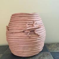 Kathie Maglio’s daughter’s pet iguana, appears on a 10½-inch-high terracotta coil pot that appeared in an exhibition of Randolph teachers’ artwork.