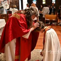 Ward considers herself a “candid event photographer,” capturing unstaged moments. Here, she photographed the Rev. Sharon Sheridan Hausman blessing the Rev. Margaret Otterburn shortly after being ordained a priest. CHRISTY WARD PHOTO