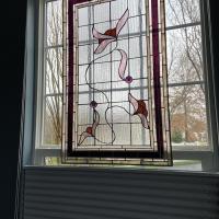 Colleen Hintz’s mother-in-law, Martha, helped create this window. The outer-most and inner-most borders are glass made from the ash of Mount St. Helens, a Washington state volcano that erupted in 1980.