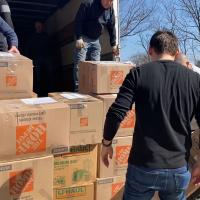 Volunteers at Holy Ascension Ukrainian Orthodox Cathedral in Clifton load donations onto a truck for transport to the shipping company.