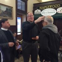 The Rev. Bernie Poppe and the Rev. Deacon Ken Boccino of St. George's, Maplewood at the Maplewood Train Station. MARTHA GARDNER PHOTO