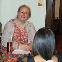 Esther Pressler of All Saints, Hoboken talks with one of The Lighthouse residents during a Coffee Chat on April 16.