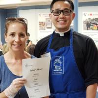 Stacey Cooper, Director of Operations at Toni's Kitchen, with the Rev. Tristan Shin, who serves as Associate Rector at St. Luke's and Chaplain at Toni's Kitchen.