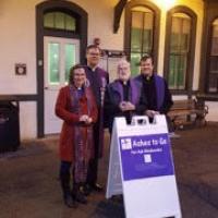 The Rev. Michael Allen of Trinity, Allendale (second from right) with Methodist, Lutheran and Presbyterian clergy at the Allendale Train Station. SHARON PIERSON PHOTO