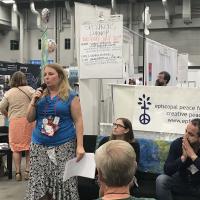 July 10: Laura Russell gives a talk at the Episcopal Peace Fellowship booth in the exhibit hall. DIANA WILCOX PHOTO