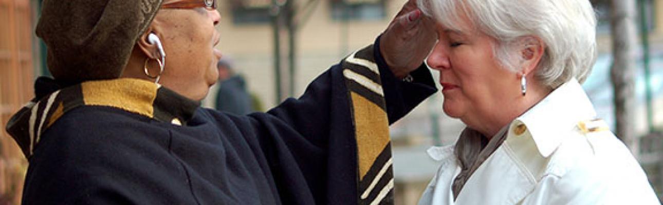 The Rev. Sandye Wilson distributes ashes at South Orange Train Station in 2011